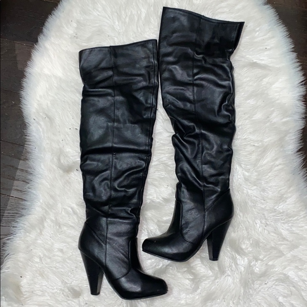 Black leather thigh high boots
